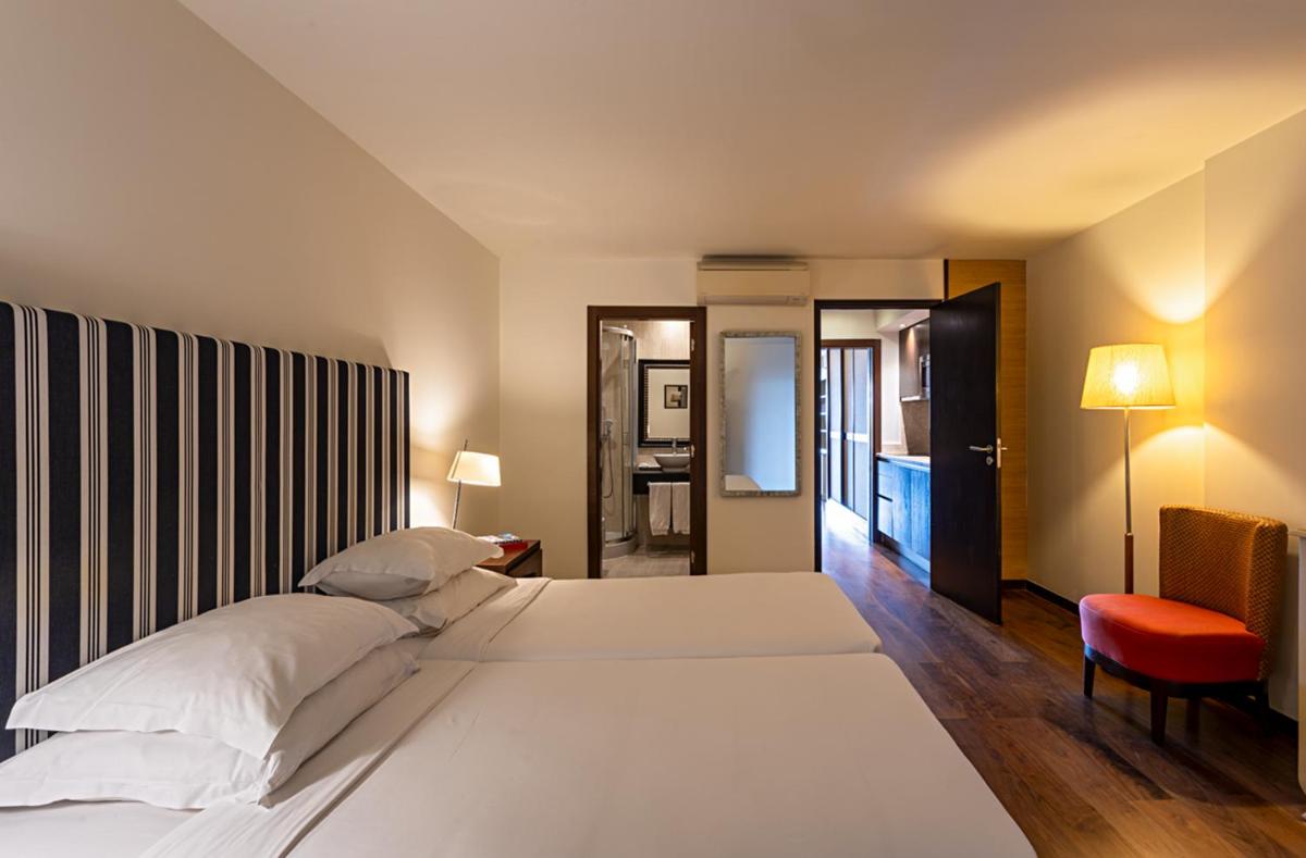 Uma cama ou camas num quarto em Pestana Alvor Praia Premium Beach & Golf Resort