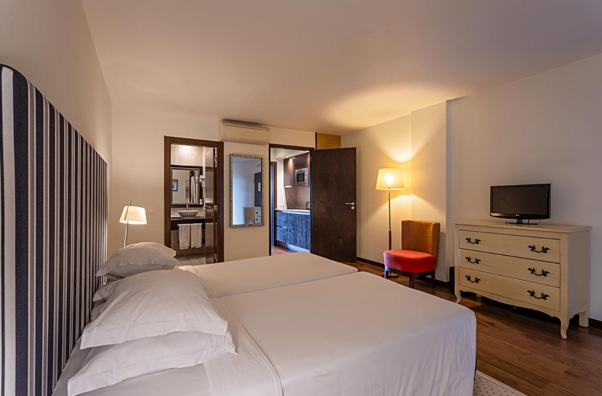 Uma cama ou camas num quarto em Pestana Alvor Praia Premium Beach & Golf Resort