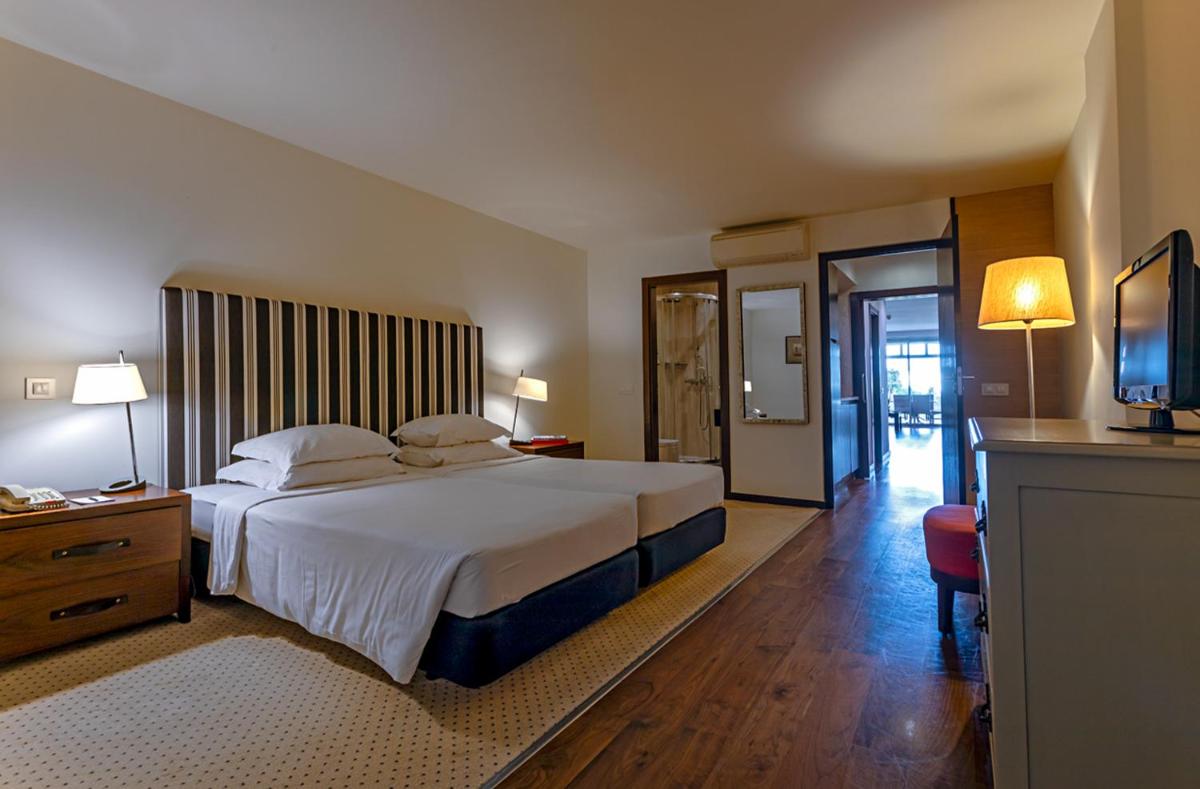 Uma cama ou camas num quarto em Pestana Alvor Praia Premium Beach & Golf Resort