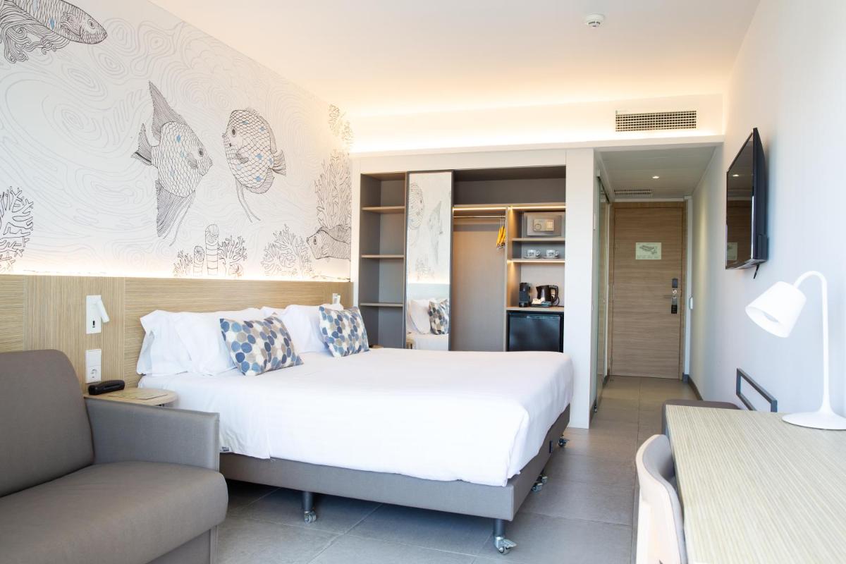 Cama o camas de una habitación en Hotel Cap Negret