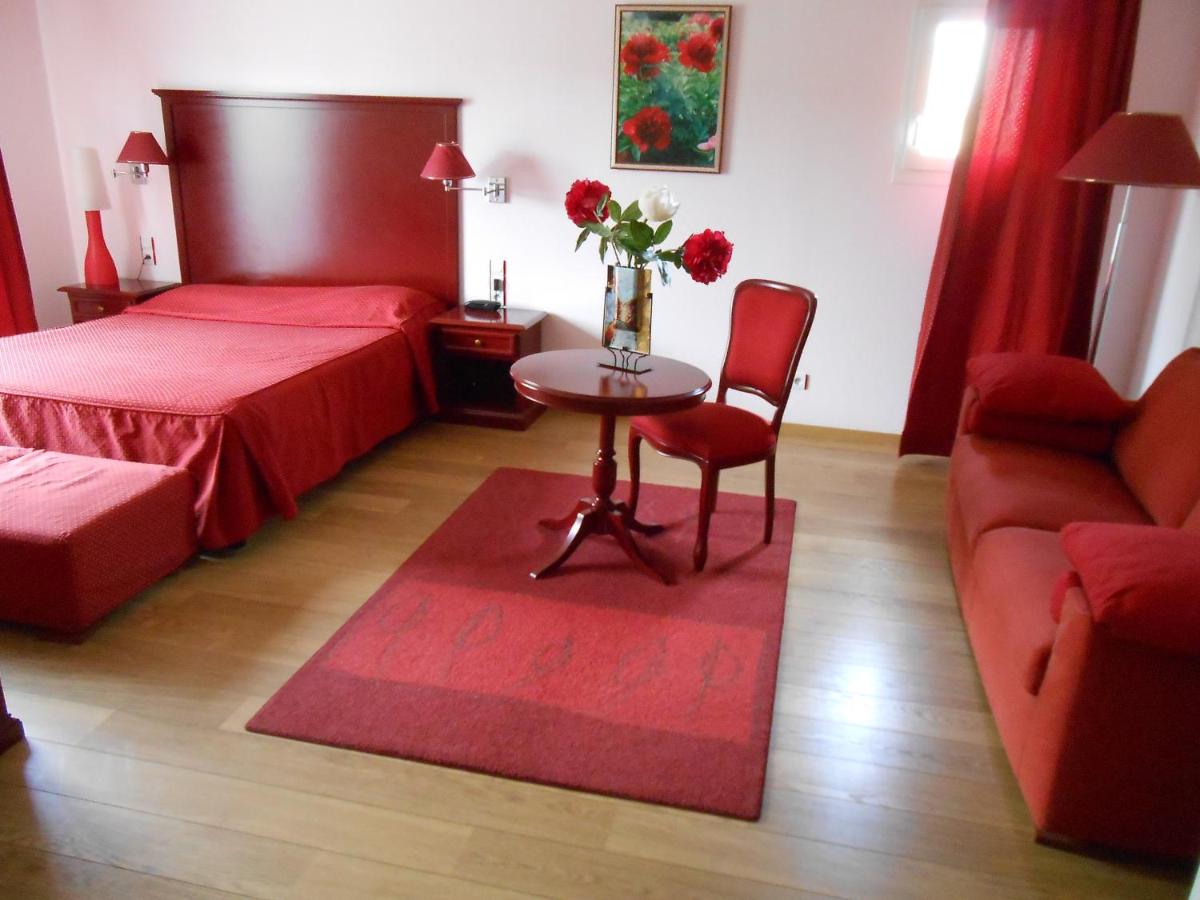 Un ou plusieurs lits dans un hébergement de l'établissement Hotel Blanc