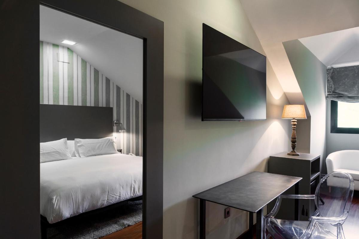 Cama o camas de una habitación en Hotel AR Isabel de Farnesio