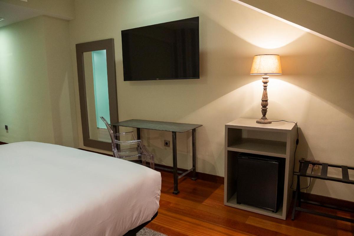 Cama o camas de una habitación en Hotel AR Isabel de Farnesio