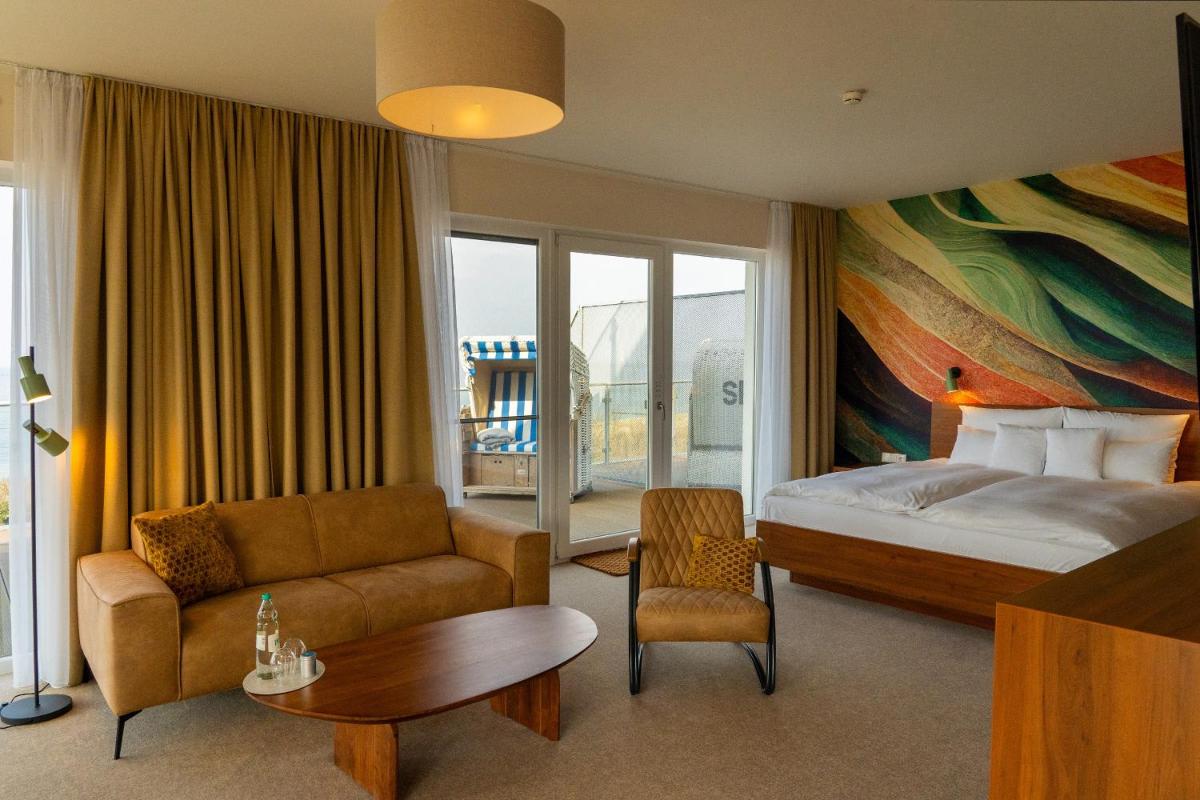Ein Bett oder Betten in einem Zimmer der Unterkunft THE GRAND Ahrenshoop