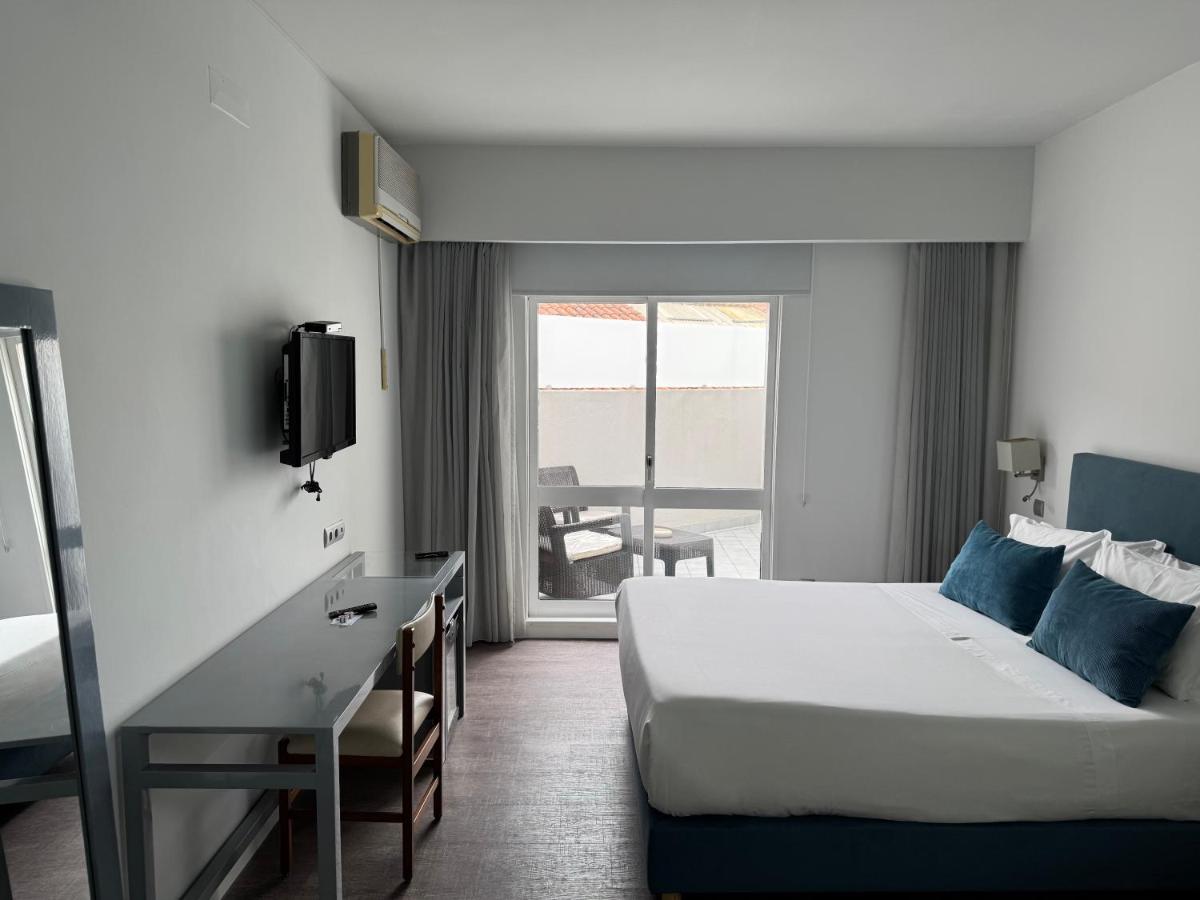 Uma cama ou camas num quarto em Hotel Rali Viana