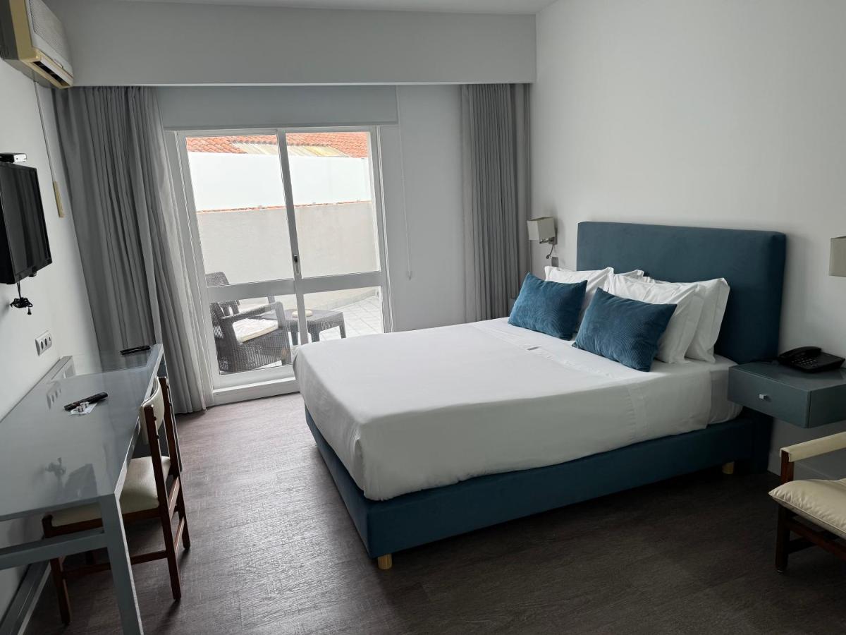 Uma cama ou camas num quarto em Hotel Rali Viana