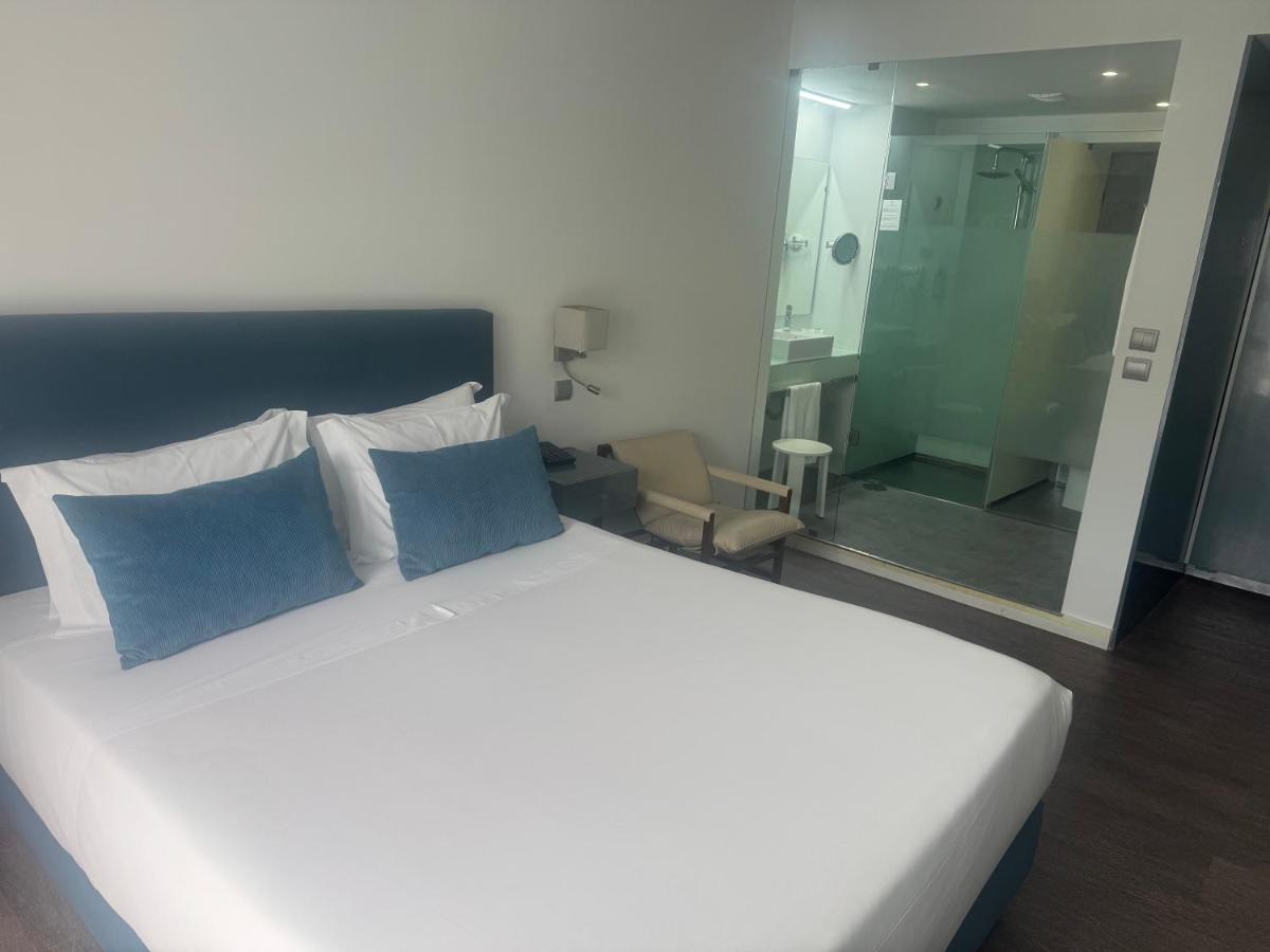 Uma cama ou camas num quarto em Hotel Rali Viana