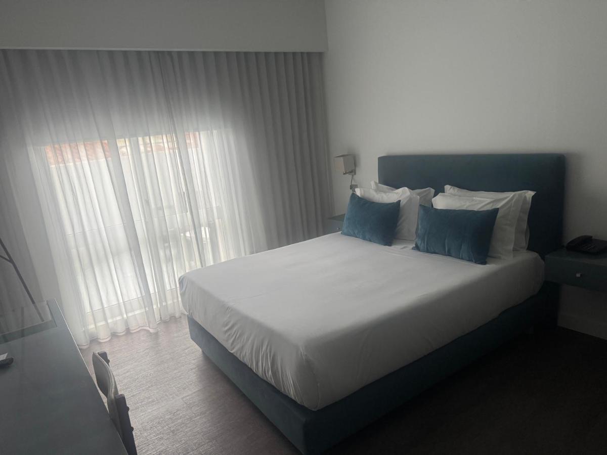 Uma cama ou camas num quarto em Hotel Rali Viana