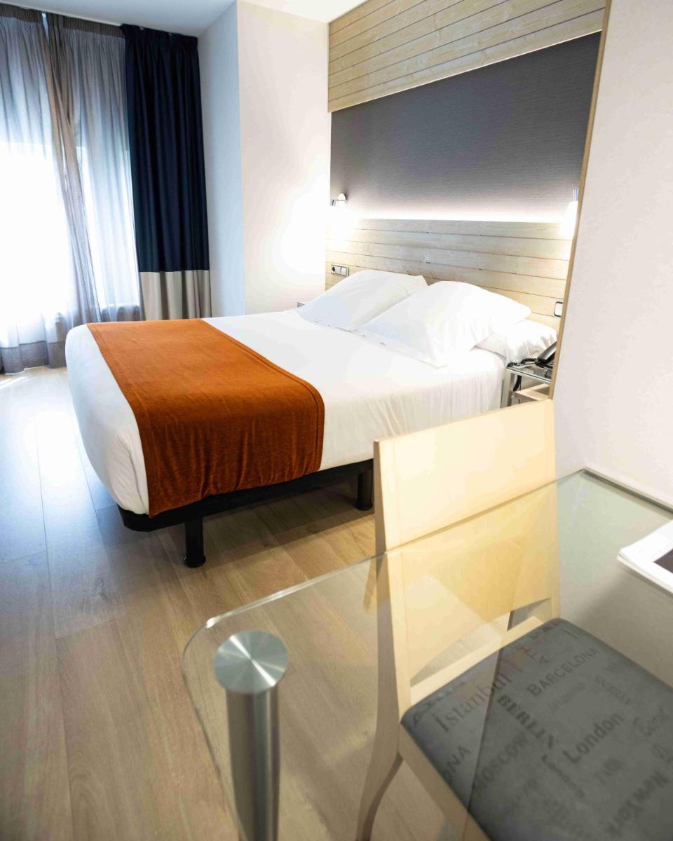 Cama o camas de una habitación en Hotel Avenida