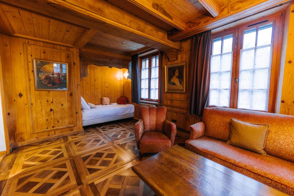 Un ou plusieurs lits dans un hébergement de l'établissement Les Violettes Hotel & Spa