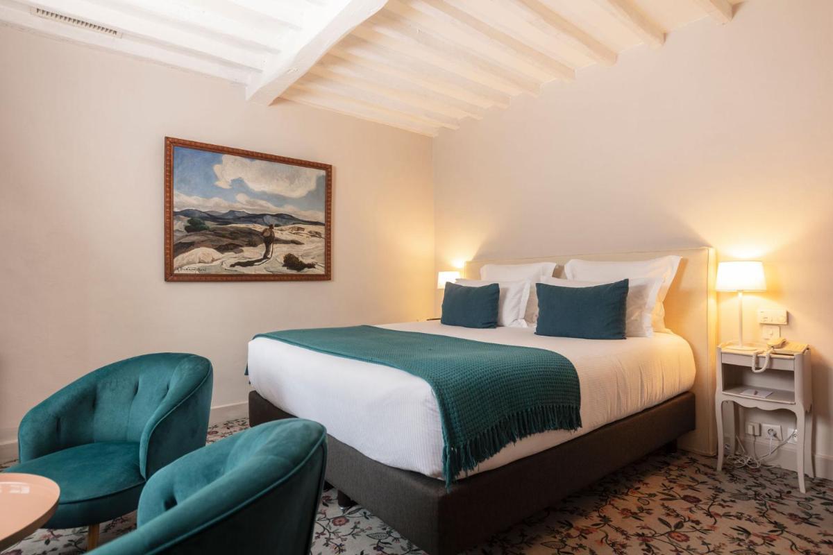Un ou plusieurs lits dans un hébergement de l'établissement Hôtel - Restaurant & Spa La Magdeleine - Mathias Dandine