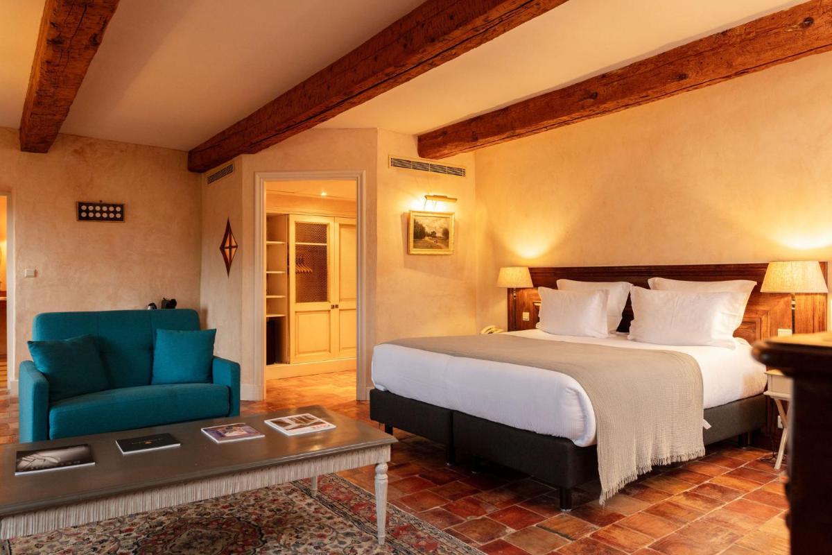 Un ou plusieurs lits dans un hébergement de l'établissement Hôtel - Restaurant & Spa La Magdeleine - Mathias Dandine