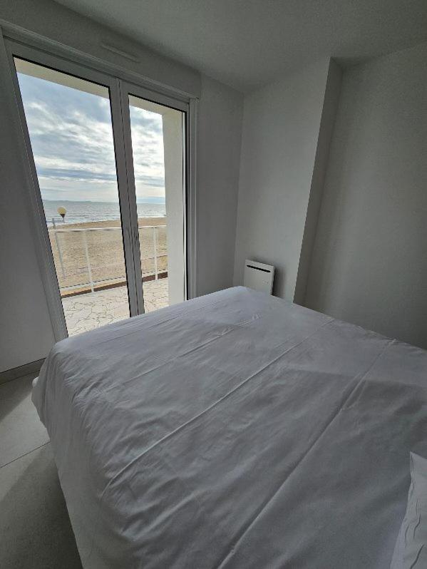Un ou plusieurs lits dans un hébergement de l'établissement Hotel Les Dunes