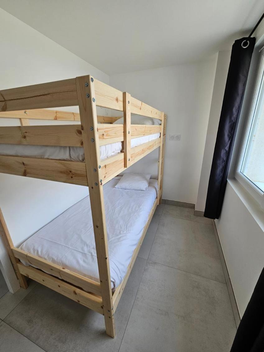 Un ou plusieurs lits dans un hébergement de l'établissement Hotel Les Dunes