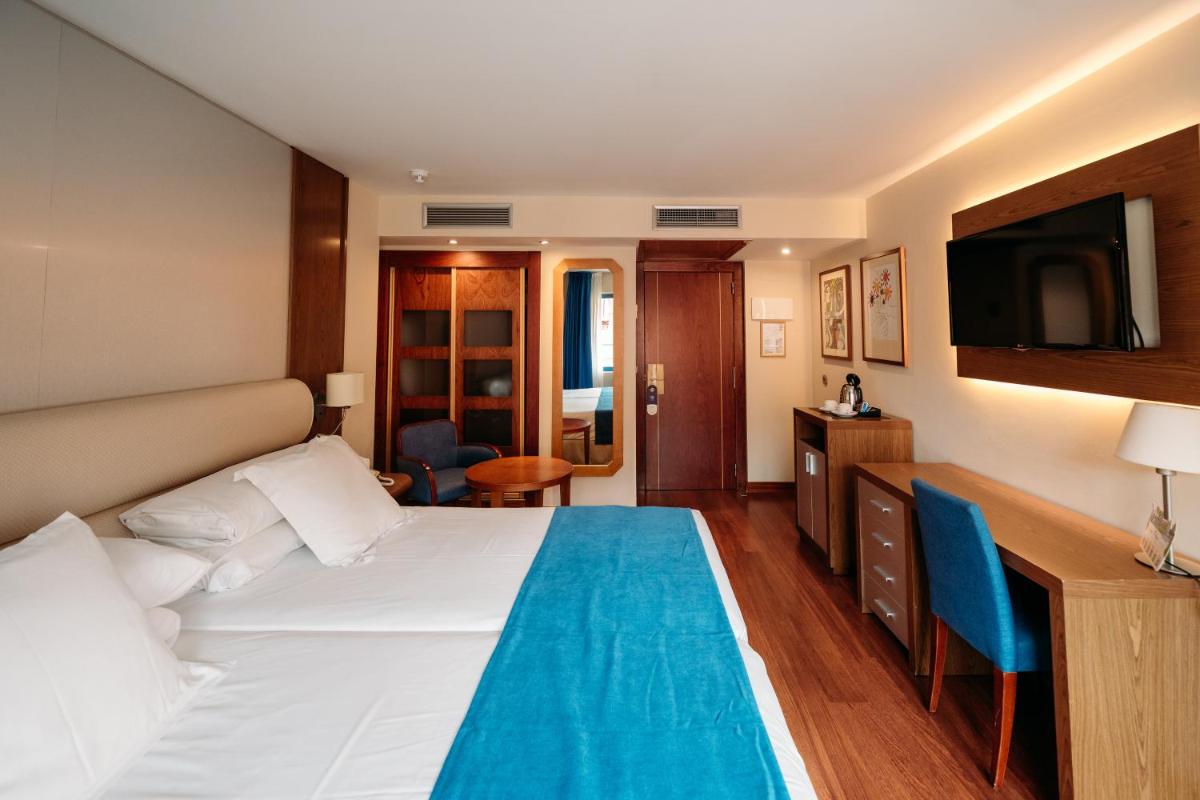 Cama o camas de una habitación en Hotel MS Maestranza Málaga