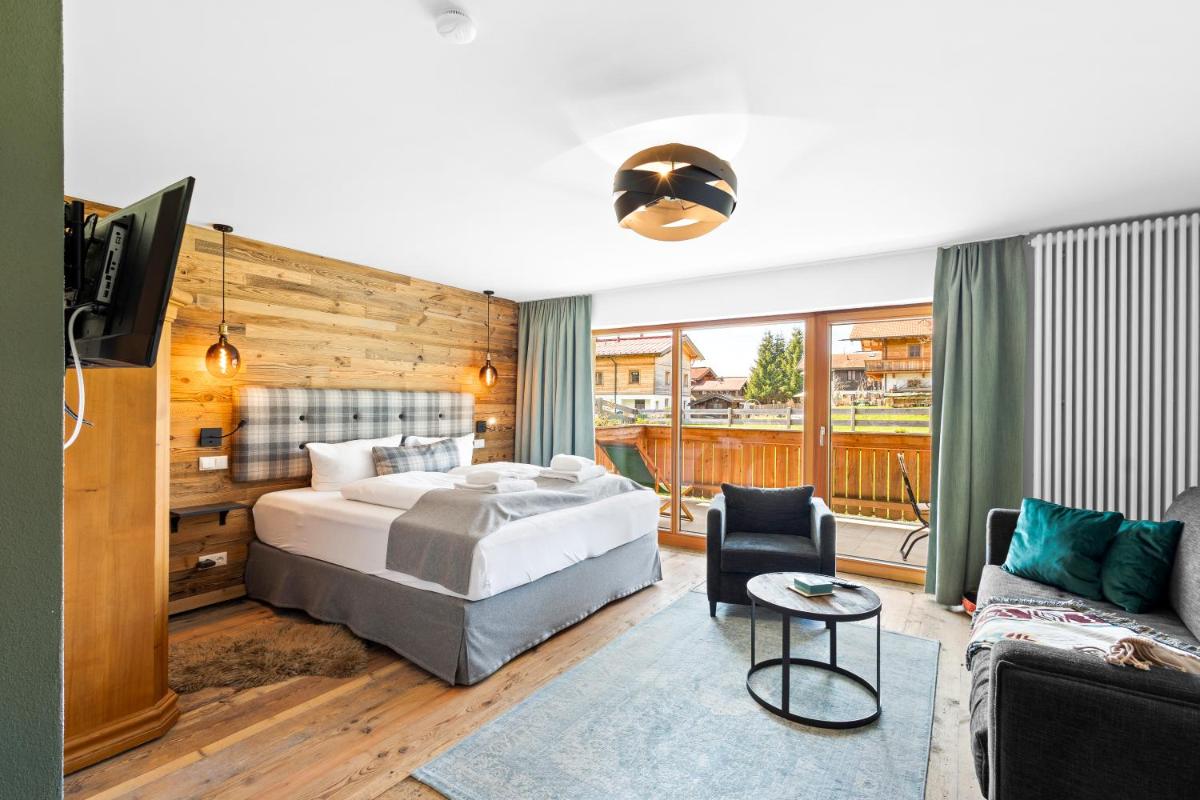 Ein Bett oder Betten in einem Zimmer der Unterkunft Soho Mountain Chalet - Pool und Sauna