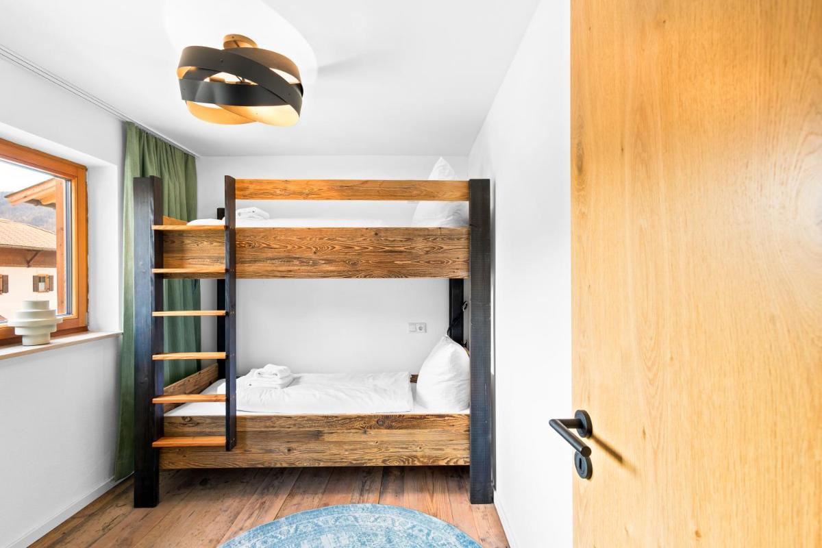 Ein Bett oder Betten in einem Zimmer der Unterkunft Soho Mountain Chalet - Pool und Sauna