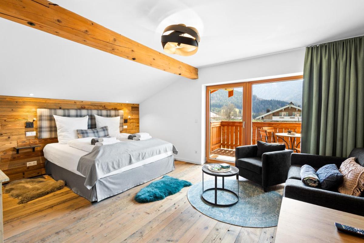 Ein Bett oder Betten in einem Zimmer der Unterkunft Soho Mountain Chalet - Pool und Sauna