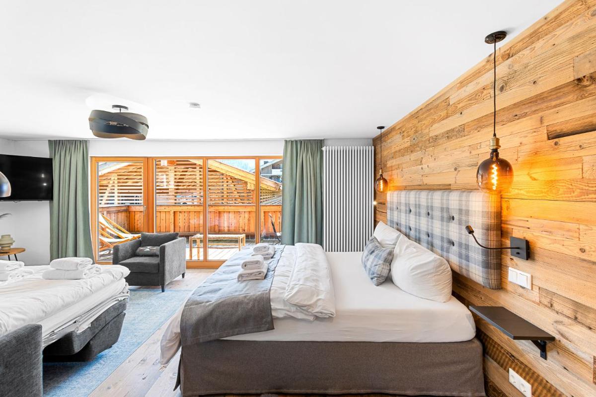 Ein Bett oder Betten in einem Zimmer der Unterkunft Soho Mountain Chalet - Pool und Sauna