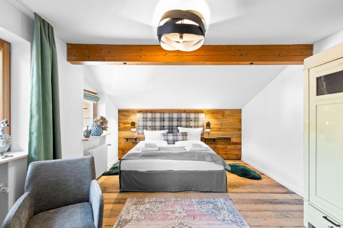 Ein Bett oder Betten in einem Zimmer der Unterkunft Soho Mountain Chalet - Pool und Sauna