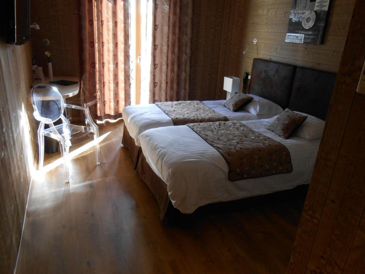 Un ou plusieurs lits dans un hébergement de l'établissement Hotel Blanc