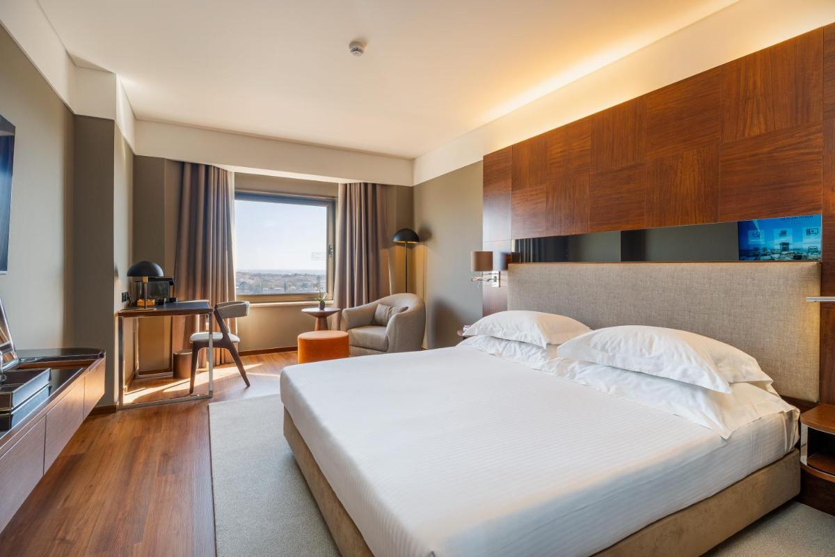 Uma cama ou camas num quarto em Porto Palácio Hotel by The Editory