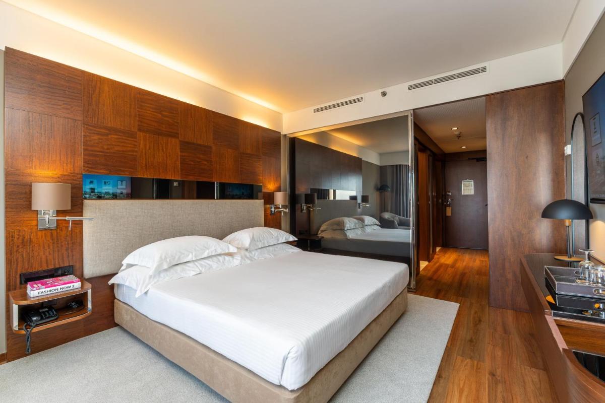 Uma cama ou camas num quarto em Porto Palácio Hotel by The Editory