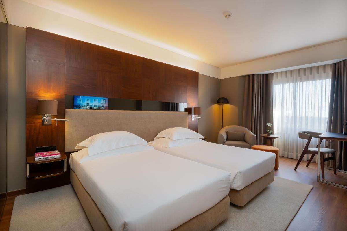 Uma cama ou camas num quarto em Porto Palácio Hotel by The Editory