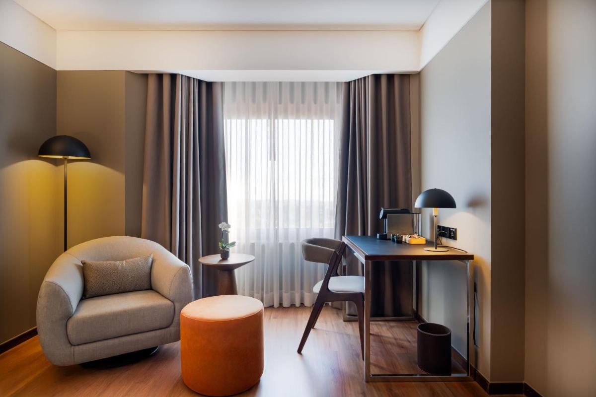 Uma área de estar em Porto Palácio Hotel by The Editory