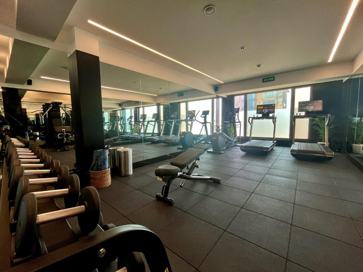 a gym with treadmills and machines in a building at InterContinental Marine Drive Mumbai by IHG in Mumbai