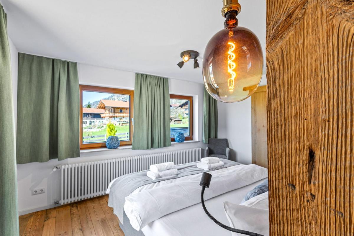 Ein Bett oder Betten in einem Zimmer der Unterkunft Soho Mountain Chalet - Pool und Sauna