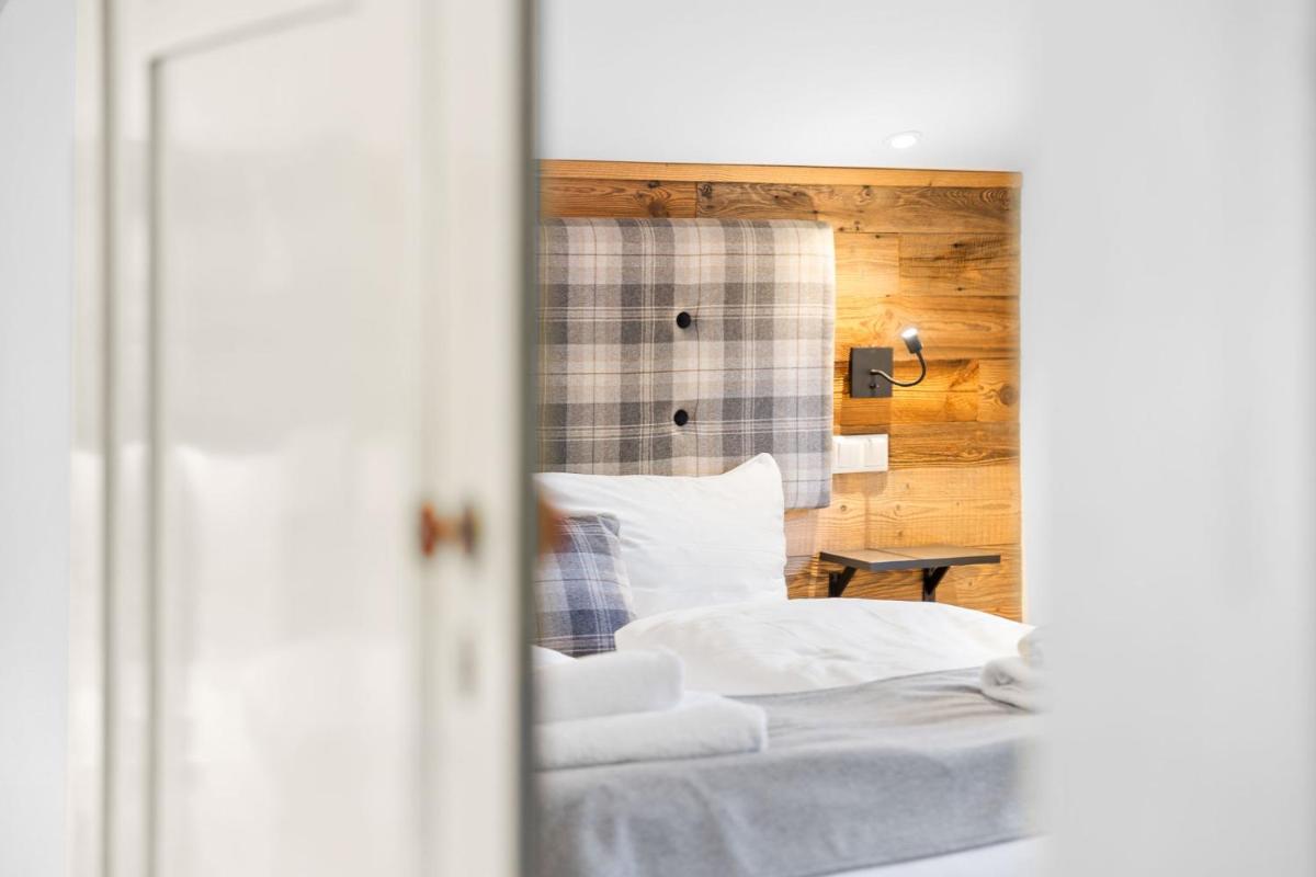 Ein Bett oder Betten in einem Zimmer der Unterkunft Soho Mountain Chalet - Pool und Sauna