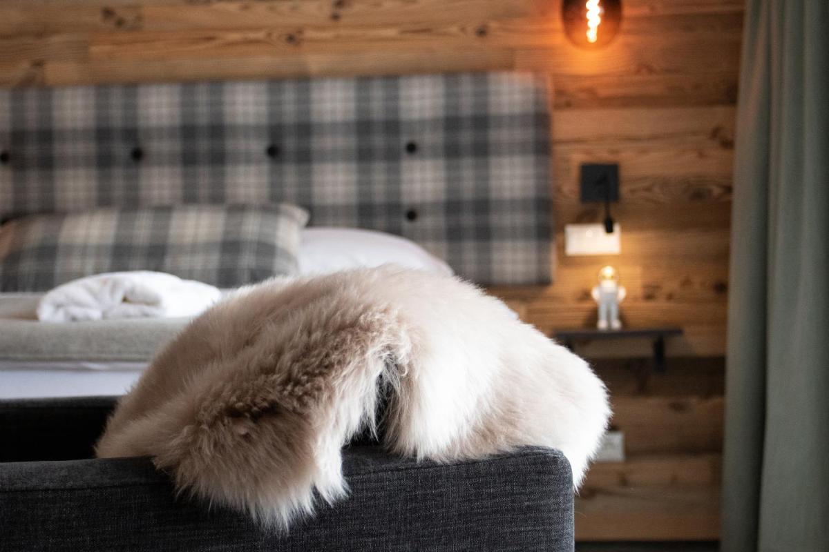 Ein Bett oder Betten in einem Zimmer der Unterkunft Soho Mountain Chalet - Pool und Sauna