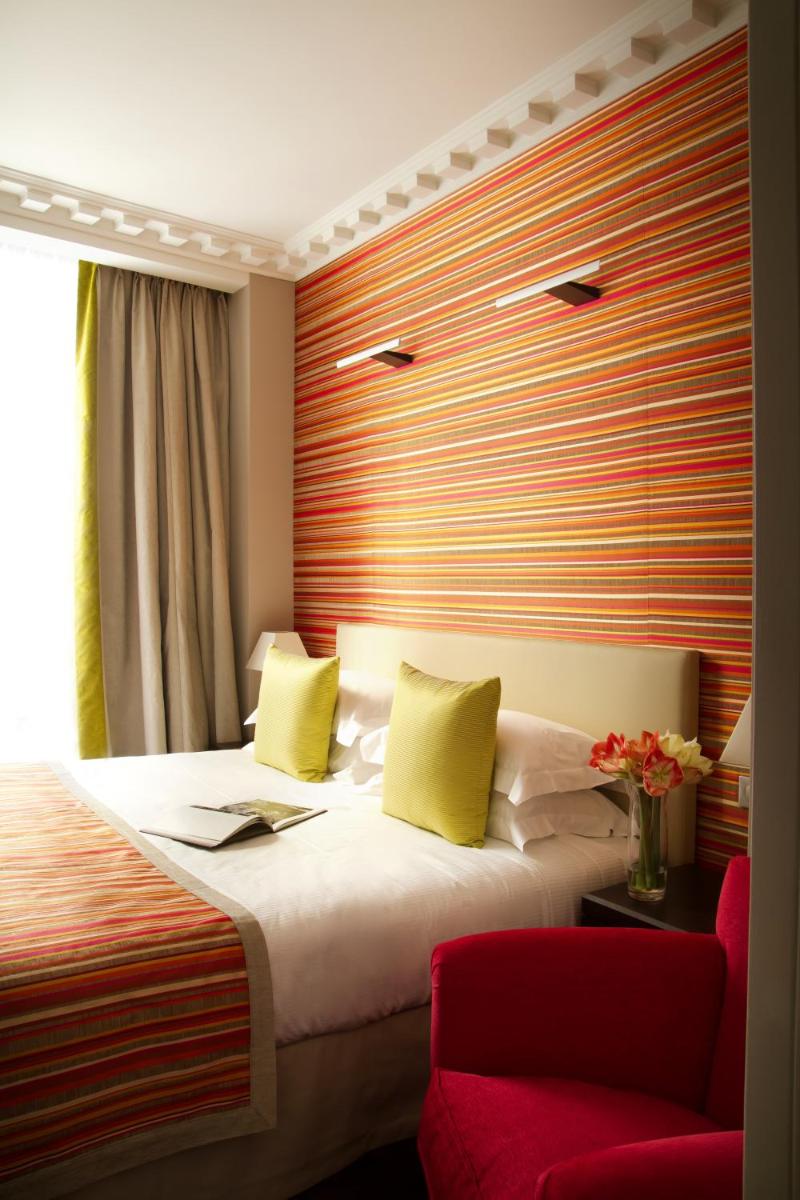 Un ou plusieurs lits dans un hébergement de l'établissement Le Mathurin Hotel & Spa