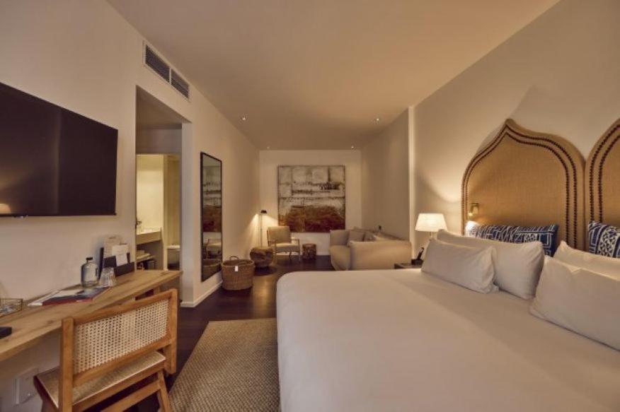 Cama o camas de una habitación en Puro Hotel Oasis Urbano