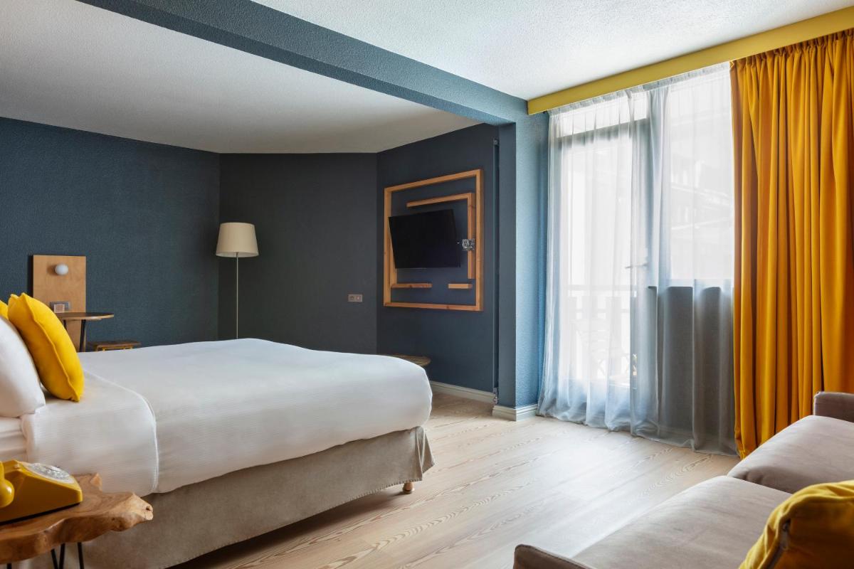 Un ou plusieurs lits dans un hébergement de l'établissement Hôtel Les Aiglons Chamonix