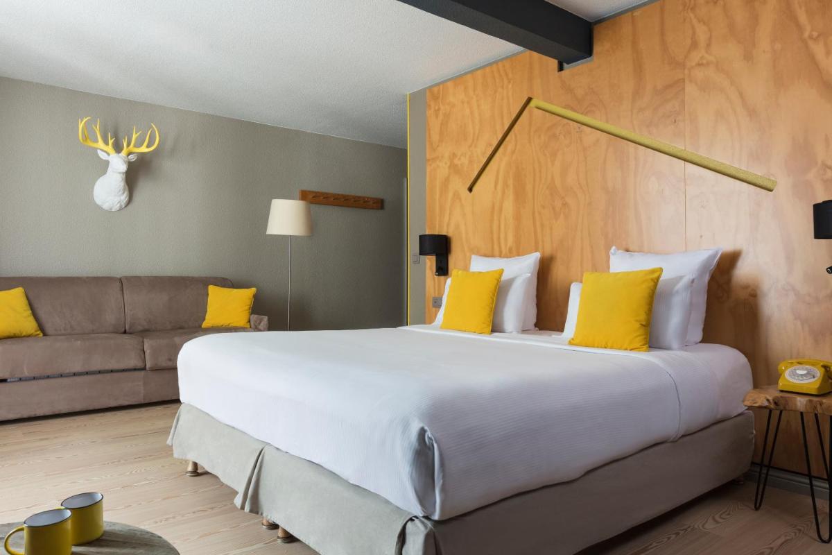 Un ou plusieurs lits dans un hébergement de l'établissement Hôtel Les Aiglons Chamonix