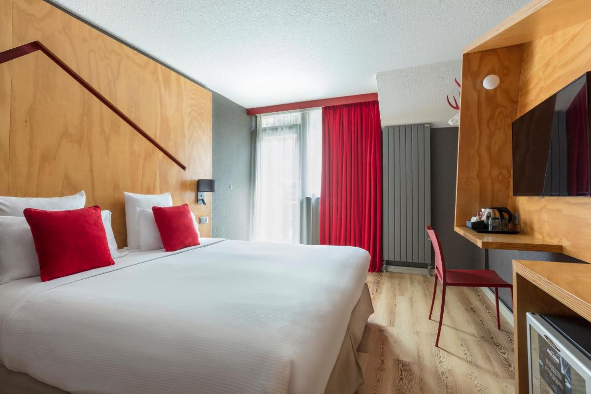 Un ou plusieurs lits dans un hébergement de l'établissement Hôtel Les Aiglons Chamonix
