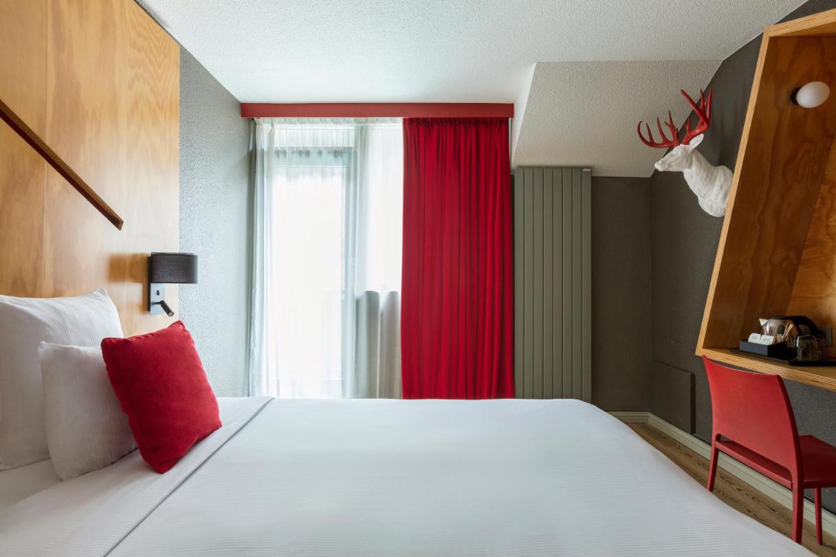 Un ou plusieurs lits dans un hébergement de l'établissement Hôtel Les Aiglons Chamonix
