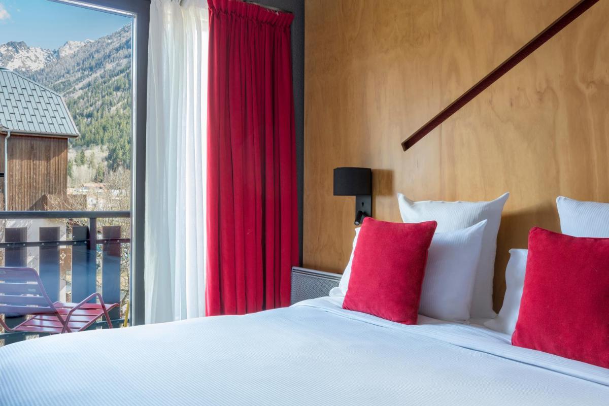 Un ou plusieurs lits dans un hébergement de l'établissement Hôtel Les Aiglons Chamonix