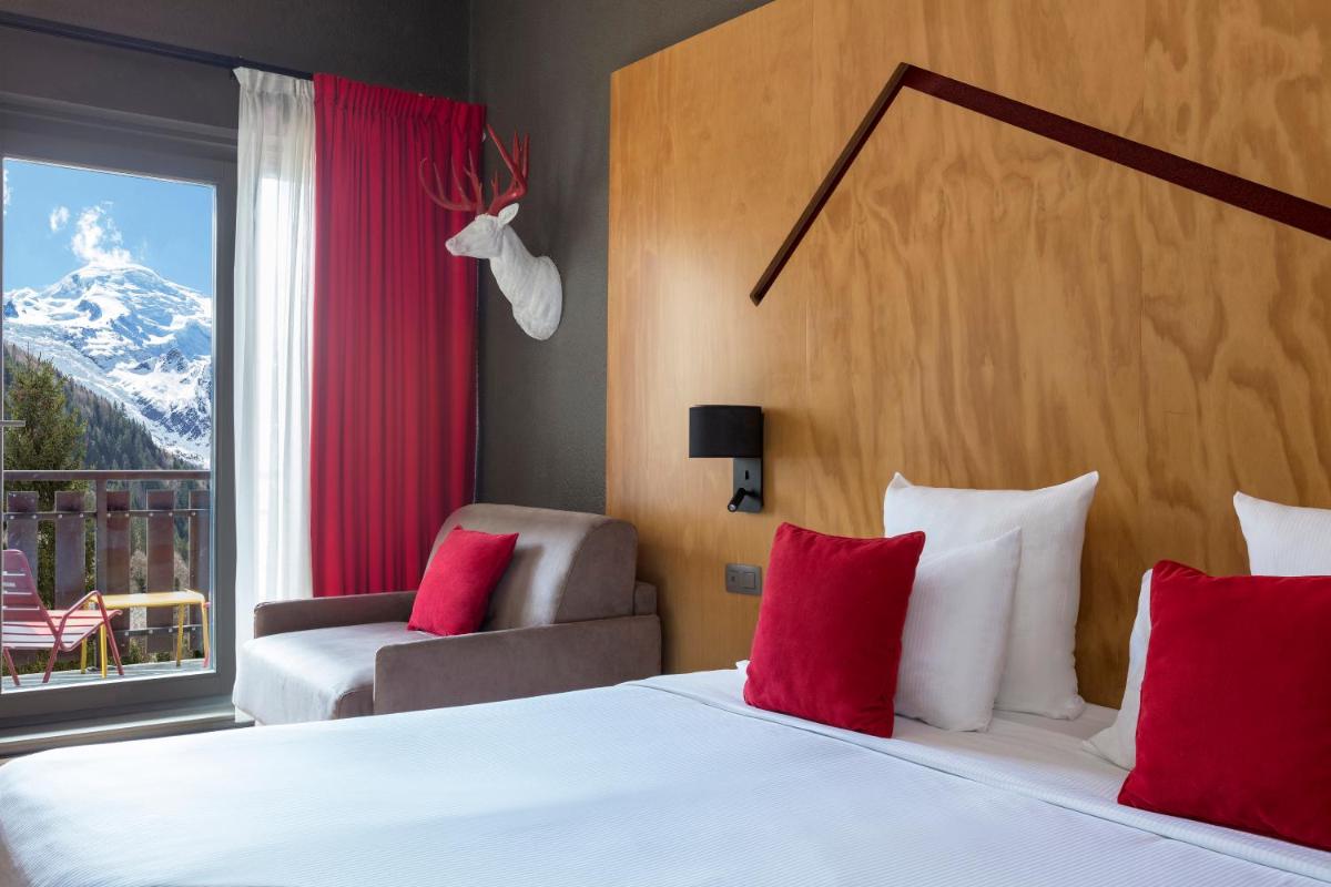 Un ou plusieurs lits dans un hébergement de l'établissement Hôtel Les Aiglons Chamonix