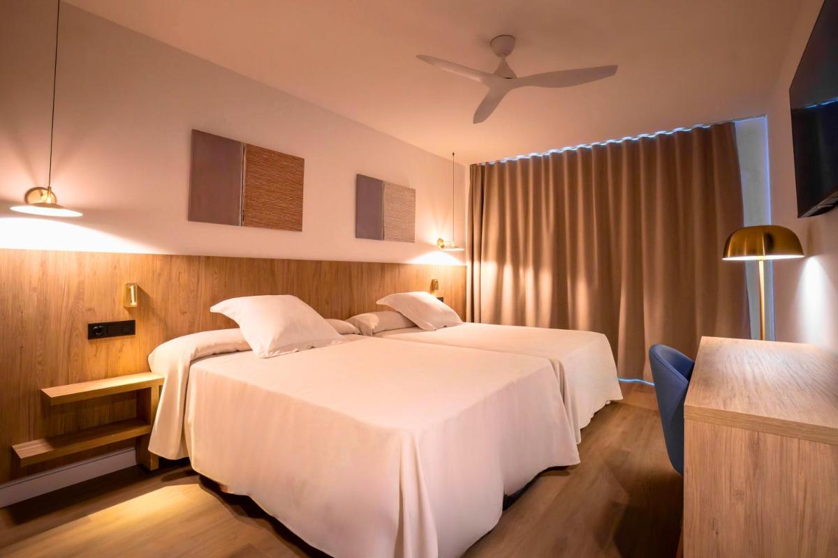 Cama o camas de una habitación en Ohtels Vil·la Romana