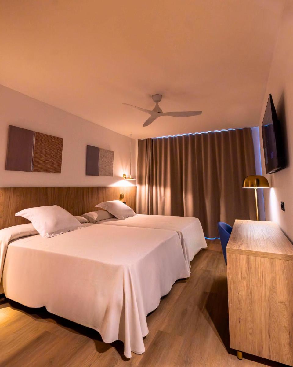 Cama o camas de una habitación en Ohtels Vil·la Romana