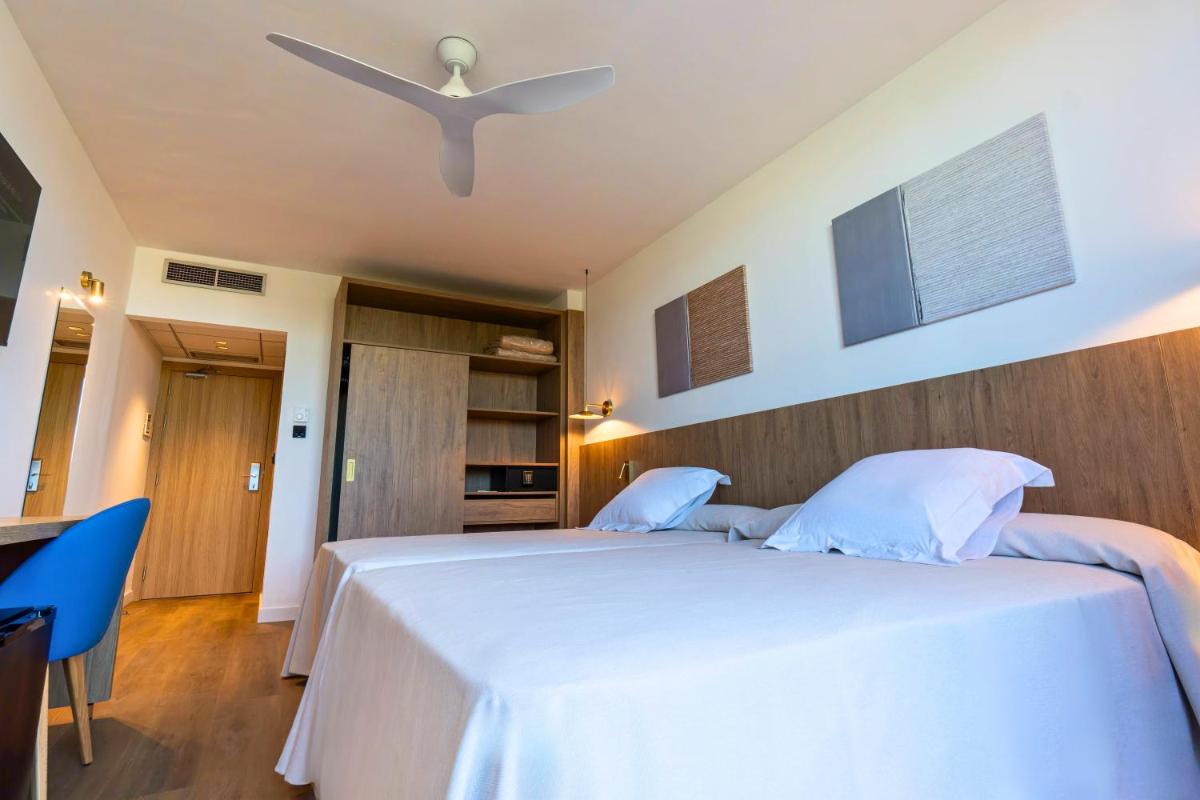 Cama o camas de una habitación en Ohtels Vil·la Romana