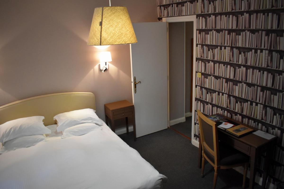 Un ou plusieurs lits dans un hébergement de l'établissement Domaine de Joinville & Spa