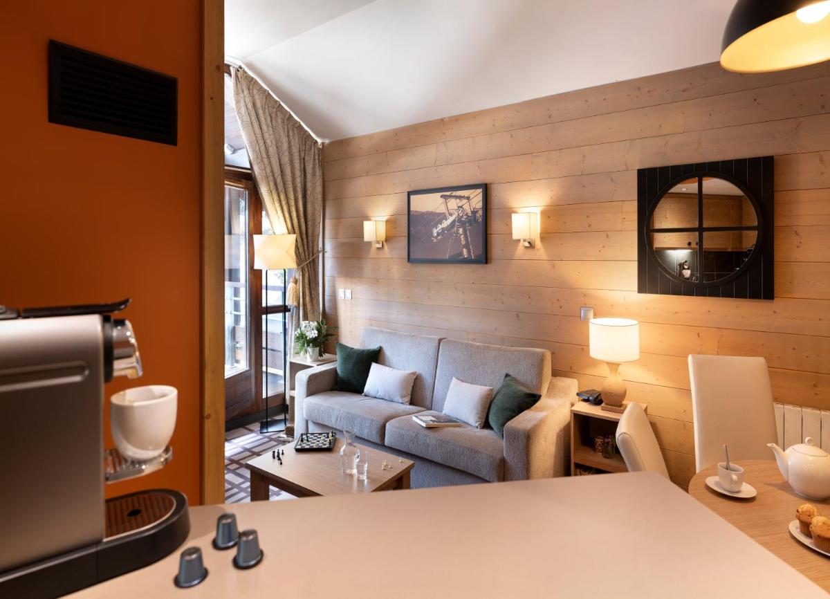 Coin salon dans l'établissement Résidence Pierre & Vacances Premium Les Terrasses d'Hélios