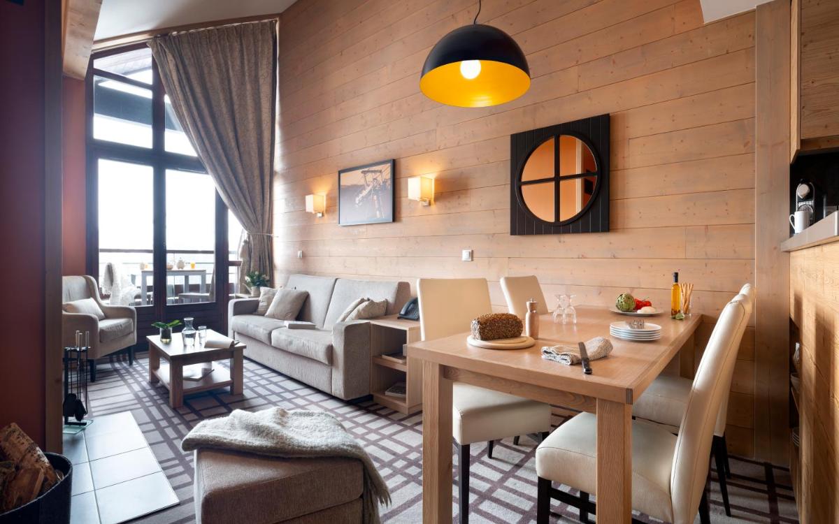Coin salon dans l'établissement Résidence Pierre & Vacances Premium Les Terrasses d'Hélios
