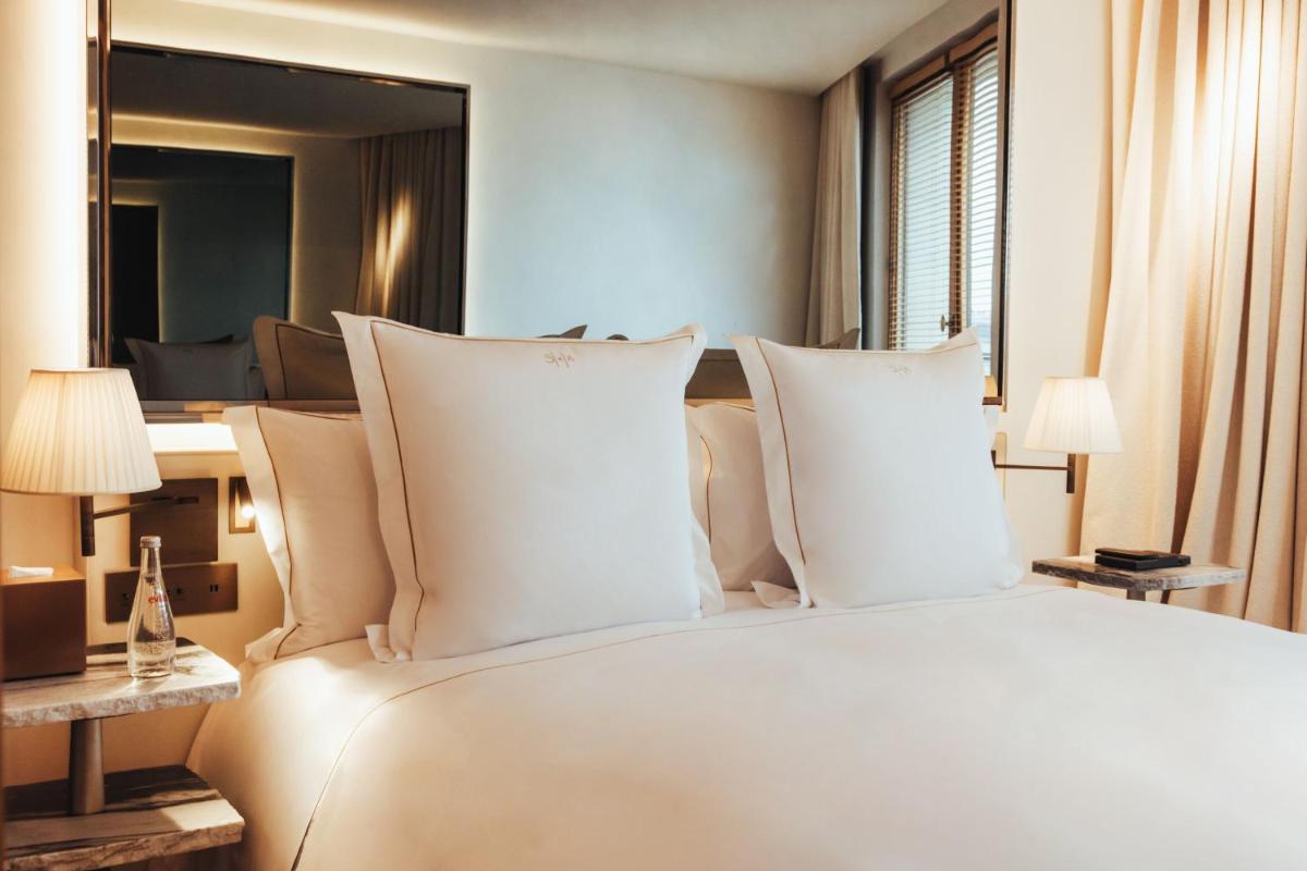 Un ou plusieurs lits dans un hébergement de l'établissement Hotel SAX Paris, LXR Hotels & Resorts