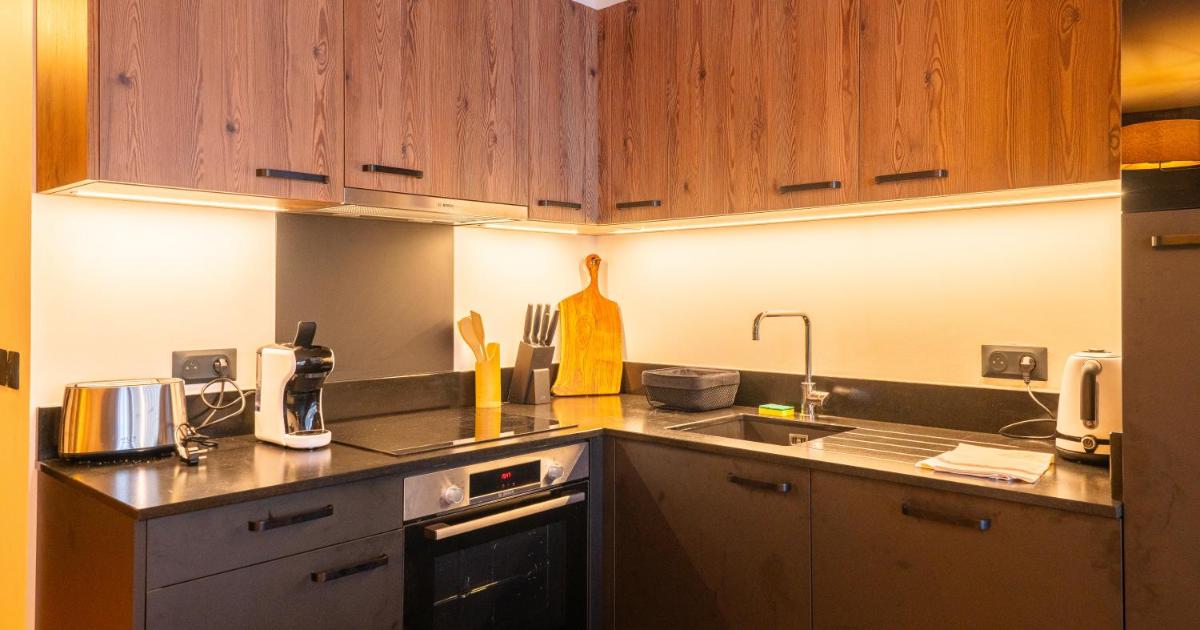 Cuisine ou kitchenette dans l'établissement Résidence l'Ecrin d'Argent by My Mountain Resort