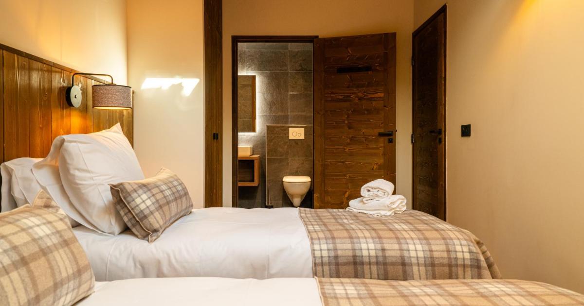 Un ou plusieurs lits dans un hébergement de l'établissement Résidence l'Ecrin d'Argent by My Mountain Resort